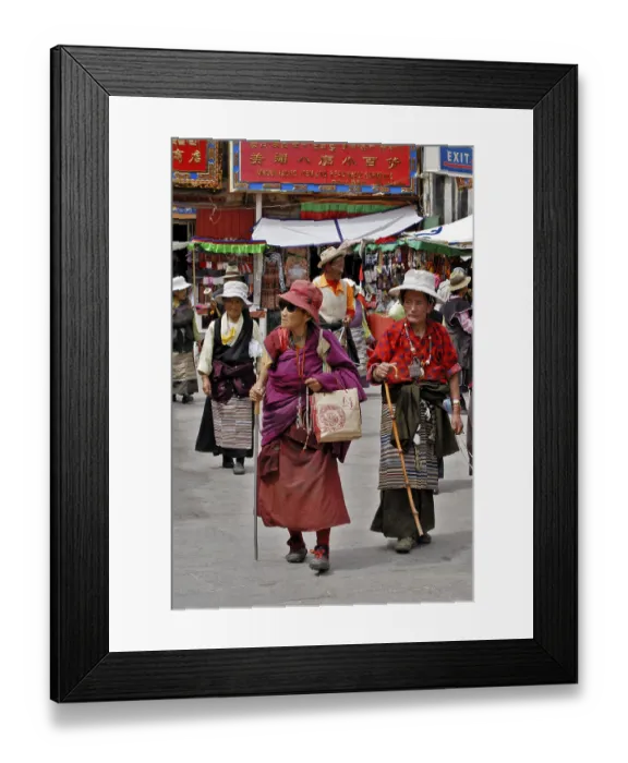 Framed Print : Old Tibetan women with prayer cords walk on the Barkor street