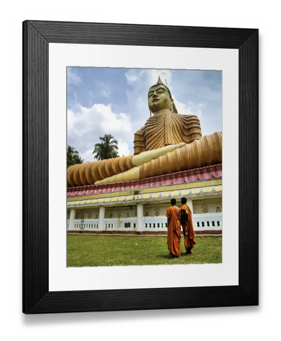 Framed Print : Monks standing in front of giant Buddha statue
