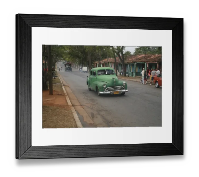 Framed Print : Vintage car driving through a street scene in Vinales Framed Print : Vintage car driving through a street scene in Vinales