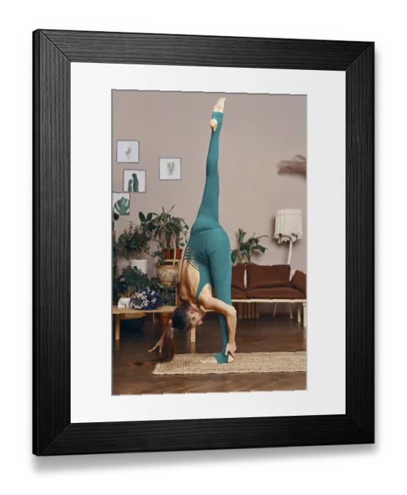 Framed Print : Young sporty woman standing vertical Split Pose practicing yoga at home Framed Print : Young sporty woman standing vertical Split Pose practicing yoga at home