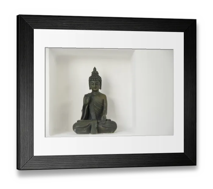 Framed Print : A buddha figure with in a recession on a white wall