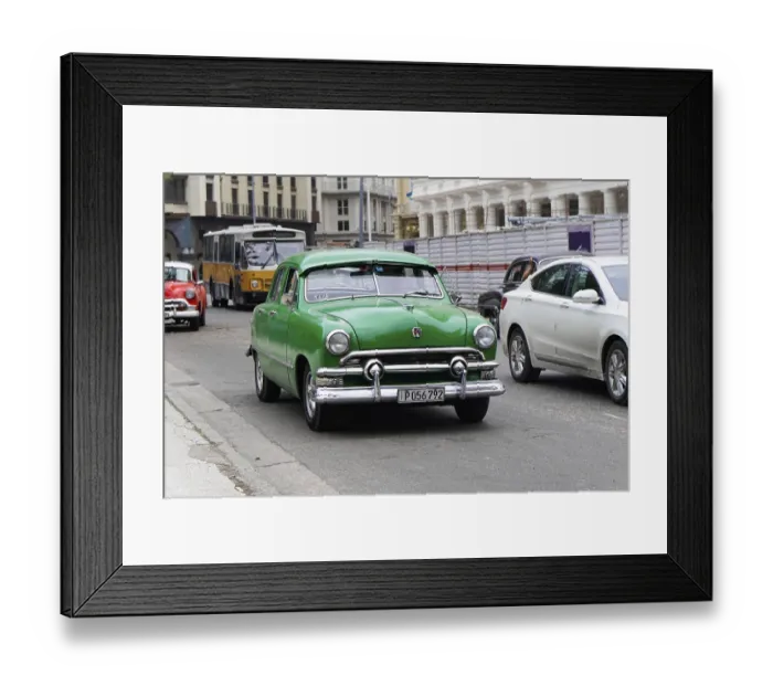 Framed Print : Havana, Cuba, Central America, Green vintage car drives through a city street together with modern cars