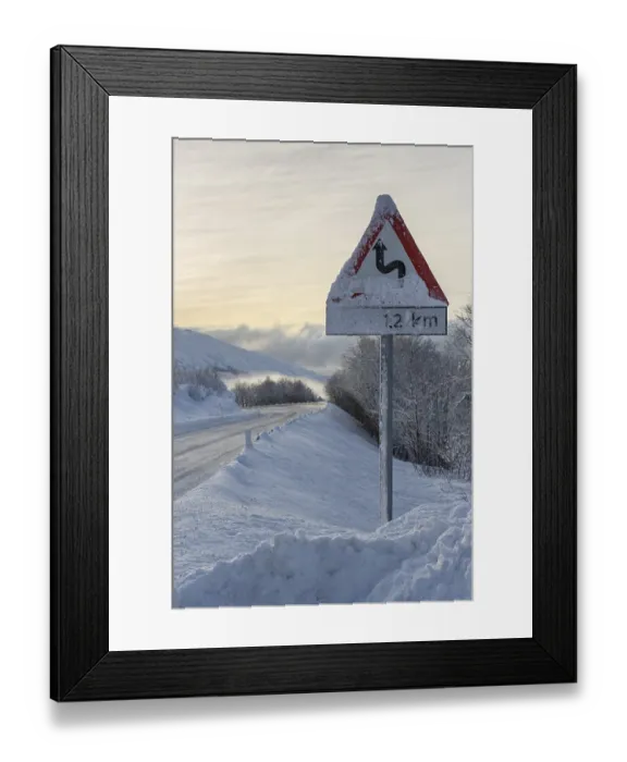 Framed Print : Wintry road with warning sign, European route E10