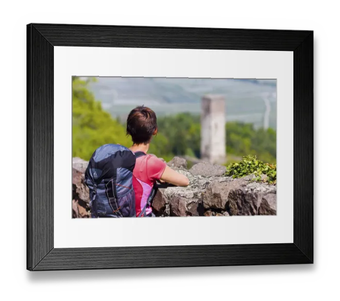 Framed Print : Castle circular walk, hiker in front of the guard tower of Hocheppan Castle Framed Print : Castle circular walk, hiker in front of the guard tower of Hocheppan Castle