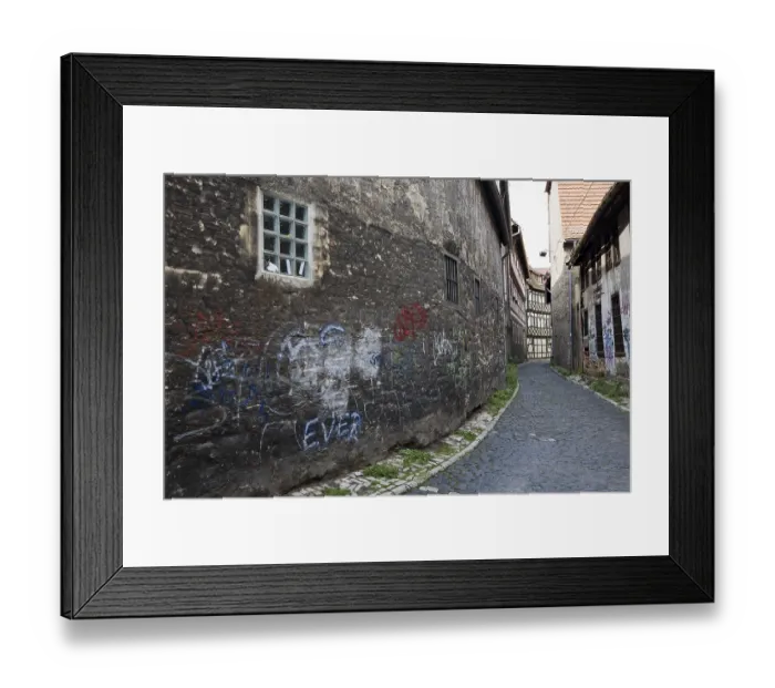 Framed Print : Old wall covered in graffiti in the historic centre of Erfurt
