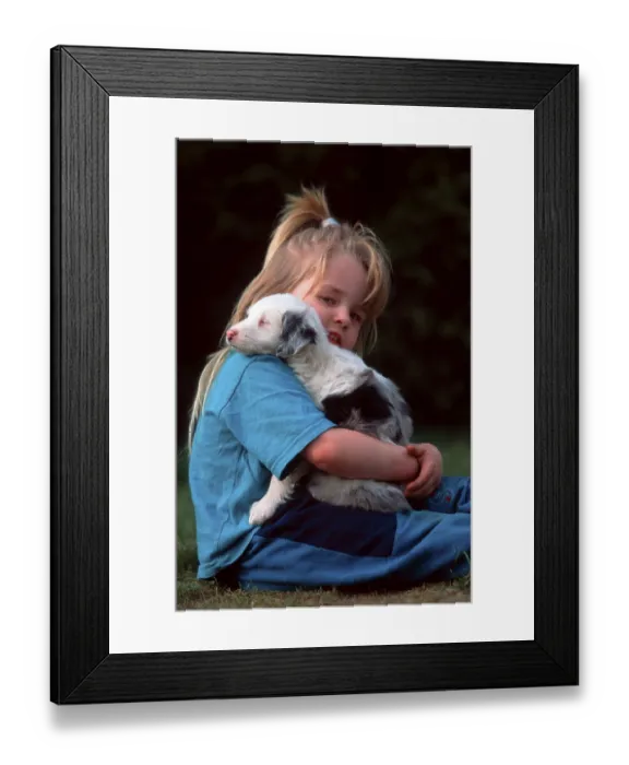 Framed Print : Girl with mixed breed dog, puppy