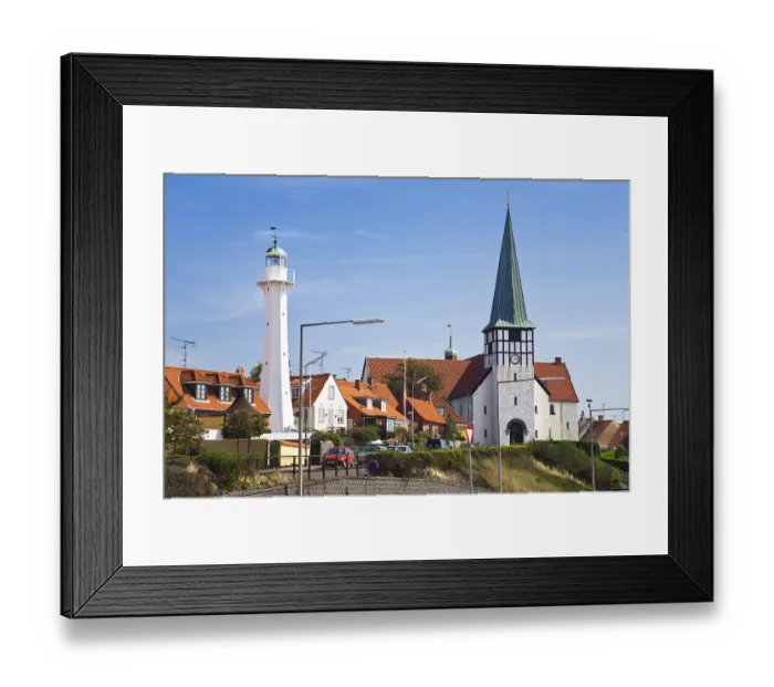 Framed Print : Timber-frame houses, lighthouse and church Skt