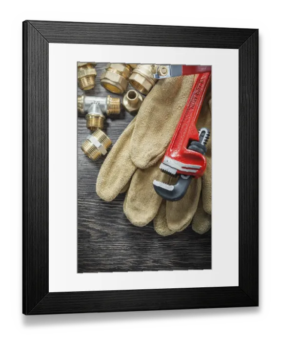 Framed Print : Plumbing monkey wrench pipe connectors protective gloves water valve on wooden board