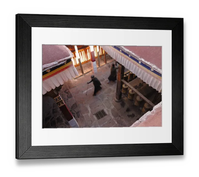Framed Print : Prayer wheels and Tibetan pilgrims near the Kora