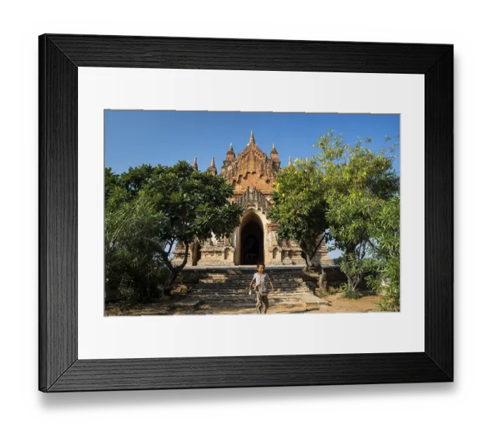 Framed Print : Boy in front of a temple, stupa or pagoda in the temple complex of the Plateau of Bagan Framed Print : Boy in front of a temple, stupa or pagoda in the temple complex of the Plateau of Bagan