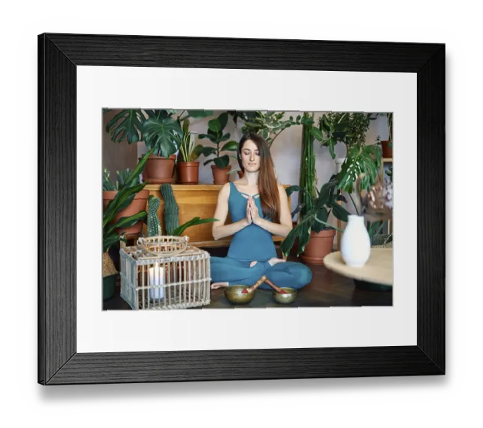 Framed Print : Young woman practicing yoga doing Ardha Padmasana exercise with namaste at home Framed Print : Young woman practicing yoga doing Ardha Padmasana exercise with namaste at home