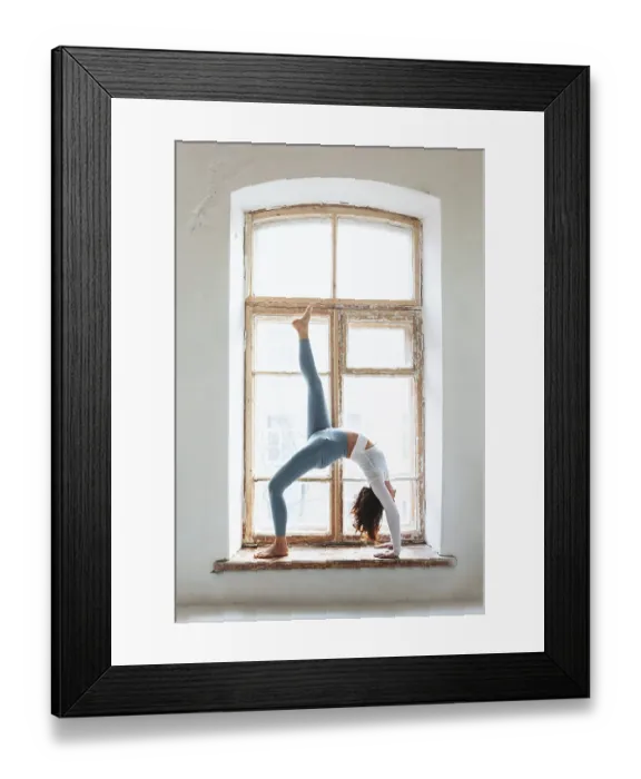 Framed Print : Side view of calm female in sportswear practicing yoga in pose while balancing on arms and looking away