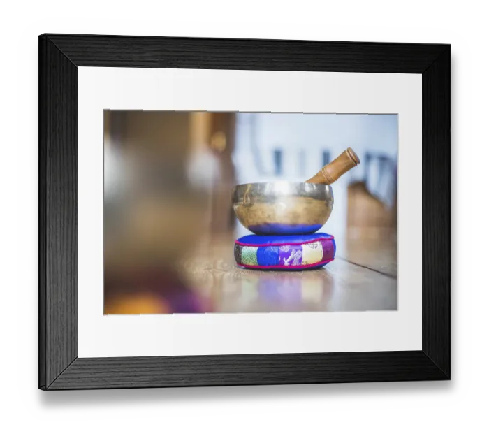 Framed Print : Metal singing bowl on a rustic wooden floor