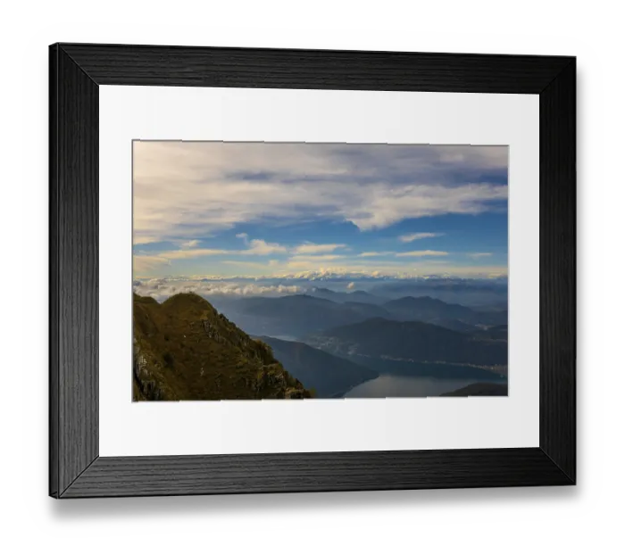 Framed Print : Aerial View over Beautiful Mountainscape with Snow Capped Mountain and Cloudscape