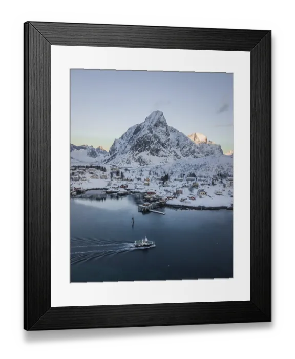 Framed Print : Aerial view of Reine with snow-covered mountains in winter Framed Print : Aerial view of Reine with snow-covered mountains in winter