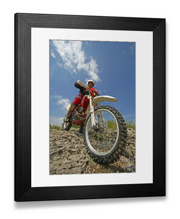 Framed Print : Off-road motorcyclist on rocks in the south of France