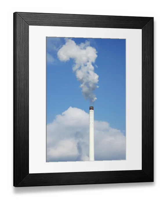 Framed Print : Smoking chimney in front of a blue sky
