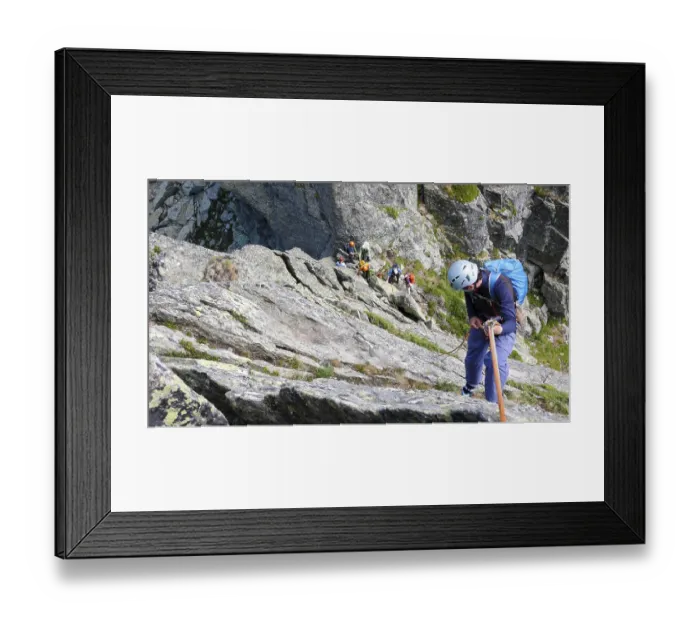 Framed Print : rock climbers traverse and climb the Clocher de Planpraz climbing route in the French Alps above Chamonix