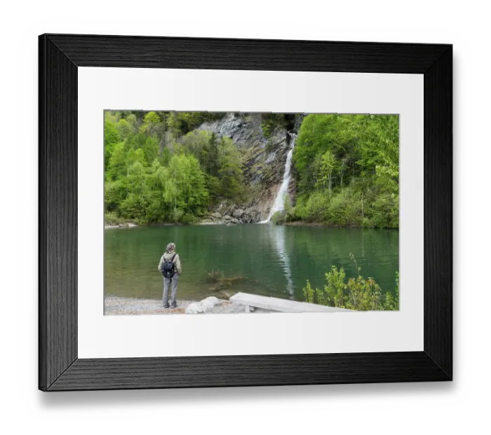 Framed Print : female hiker looking at the Saarbach waterfall