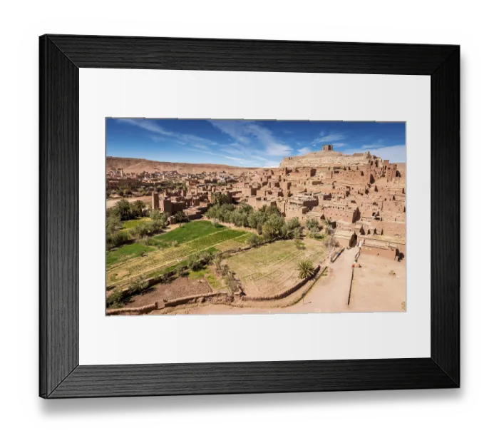 Framed Print : Fortified village, mud brick houses and palm trees