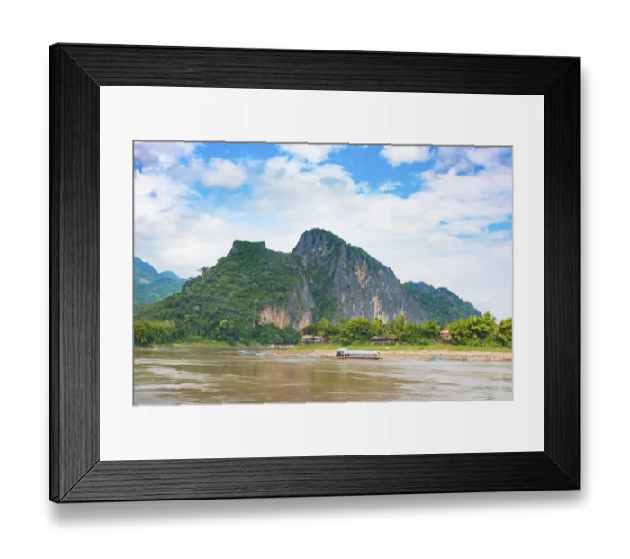 Framed Print : Mountain landscape with overgrown limestone rock and karst mountains along the Mekong River Framed Print : Mountain landscape with overgrown limestone rock and karst mountains along the Mekong River