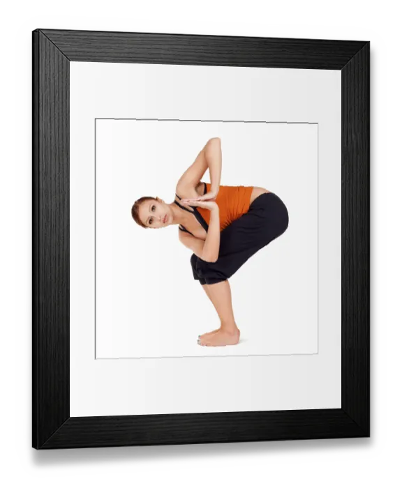 Framed Print : Young fit woman practicing yoga exercise called: Twisted Chair Pose sanskrit name: Parivrtta Utkatasana