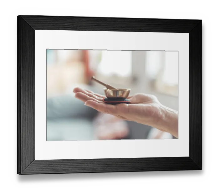 Framed Print : Small singing bowl holding in hand