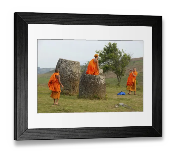 Framed Print : Buddhist monks wearing bright orange robes visiting the Plain of Jars Framed Print : Buddhist monks wearing bright orange robes visiting the Plain of Jars