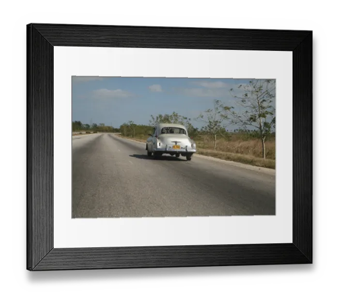 Framed Print : Vintage car driving along the autopista from Vinales to Havana
