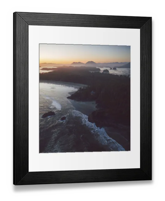 Framed Print : A scenic coastline at sunset with waves crashing on the beach