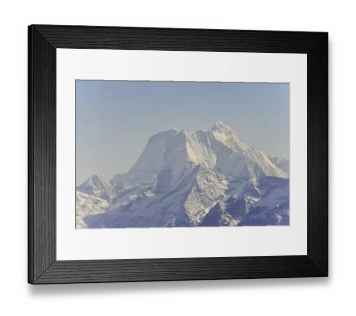 Framed Print : Snow-covered mountain peaks under a clear sky