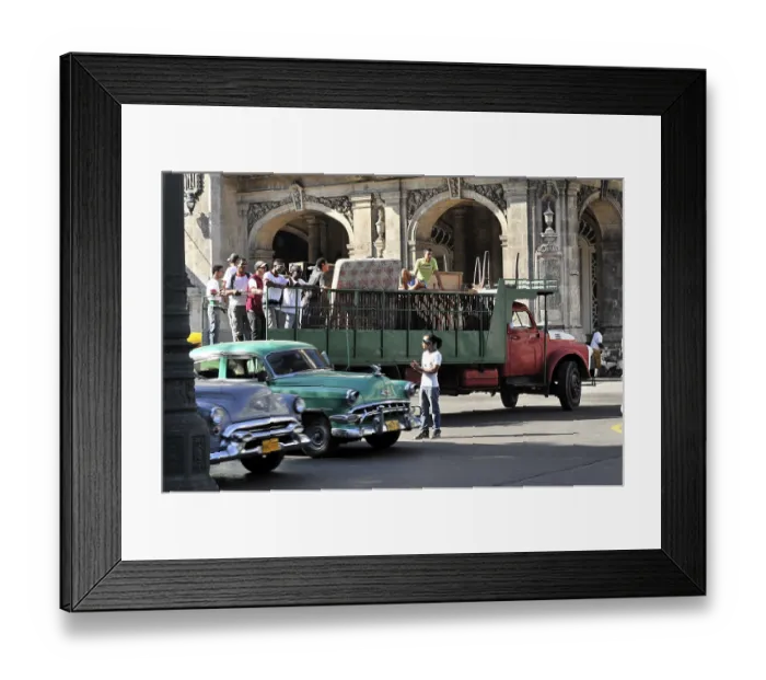 Framed Print : Group of people preparing to board a vintage city bus