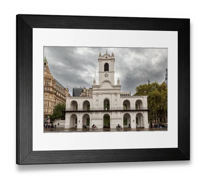 Framed Print : An old colonial style building with clock tower under a cloudy sky in the city
