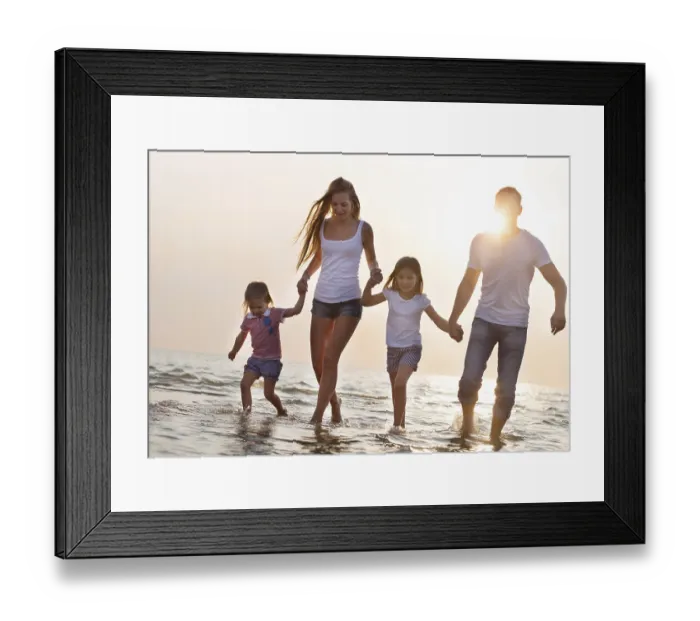 Framed Print : Happy young family having fun running on beach at sunset Framed Print : Happy young family having fun running on beach at sunset