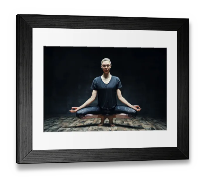 Framed Print : Young beautiful woman doing yoga asana tiptoe pose prapadasana variation on dark room