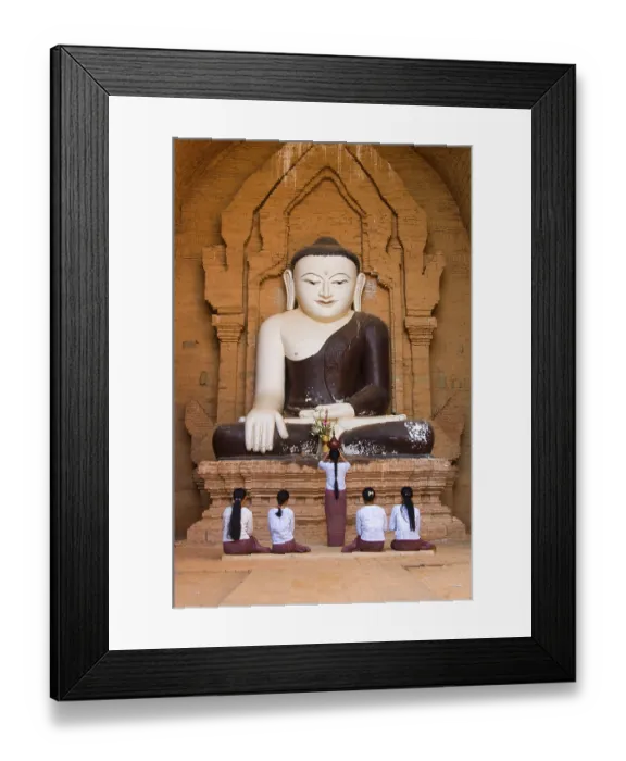 Framed Print : Praying believers in front of Buddha statue Framed Print : Praying believers in front of Buddha statue