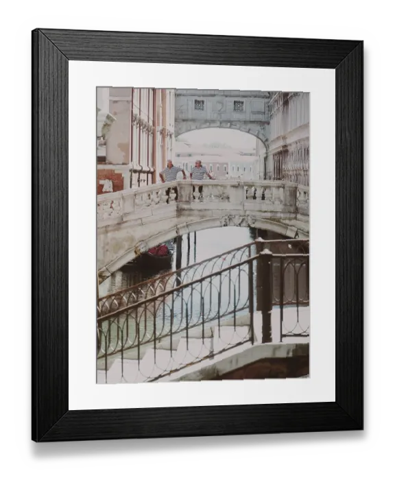 Framed Print : Two people standing on a historic Sighs bridge over a canal on a sunny day