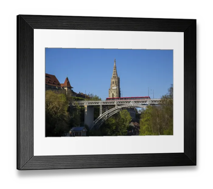 Framed Print : Bern, Switzerland, April 13, 2017: Train driving over Kirchenfeld Bridge with the Cathedral in the background Framed Print : Bern, Switzerland, April 13, 2017: Train driving over Kirchenfeld Bridge with the Cathedral in the background