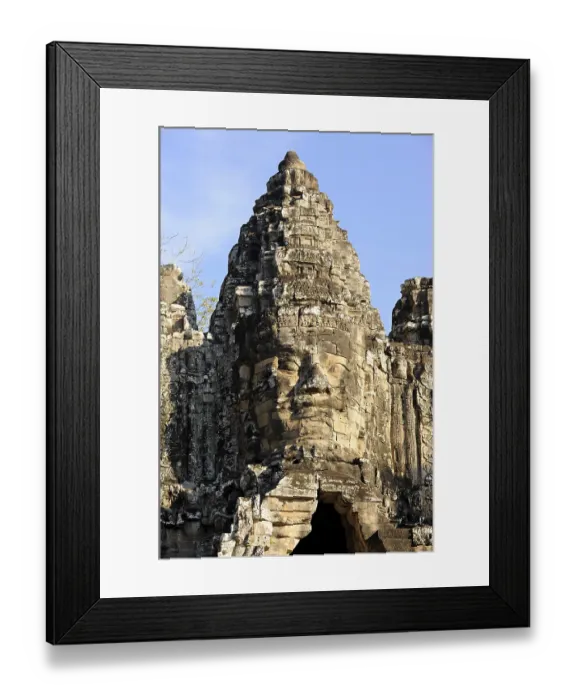 Framed Print : Carved stone face of Bodhisattva Lokeshvara over the south gate of Angkor Thom
