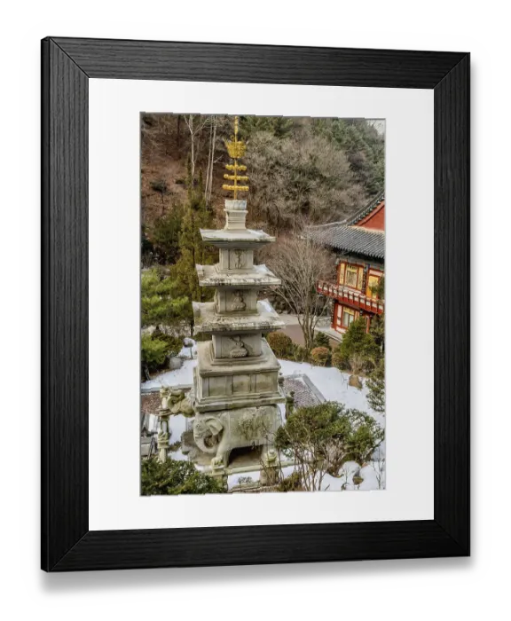 Framed Print : Four story stone carved pagoda on plinth of three elephants at Buddhist temple in South Korea