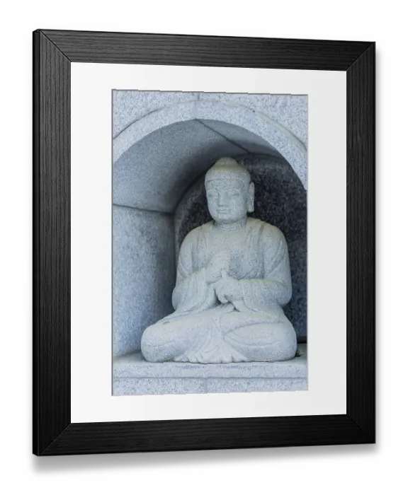 Framed Print : Seated Buddha in small alcove built inside concrete wall in Daejeon