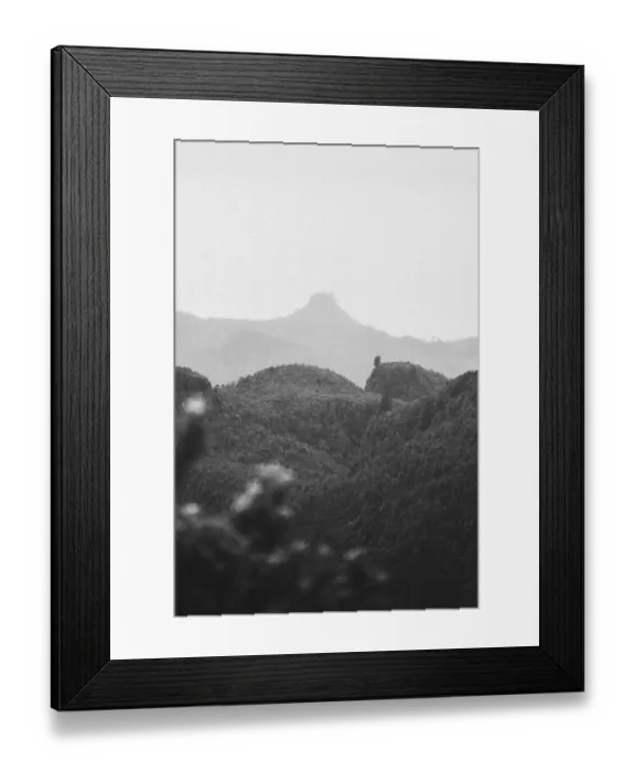 Framed Print : View of misty hills and mountains in black and white