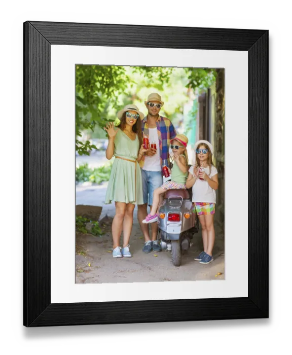 Framed Print : Happy young family near the vintage scooter in the street wearing hats and sunglasses Framed Print : Happy young family near the vintage scooter in the street wearing hats and sunglasses