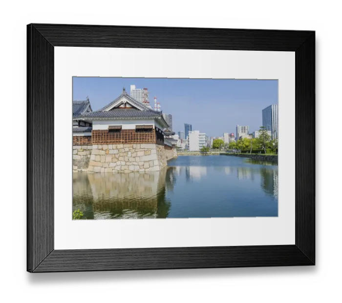 Framed Print : Ancient Hiroshima palace and mote with city buildings in background in Hiroshima
