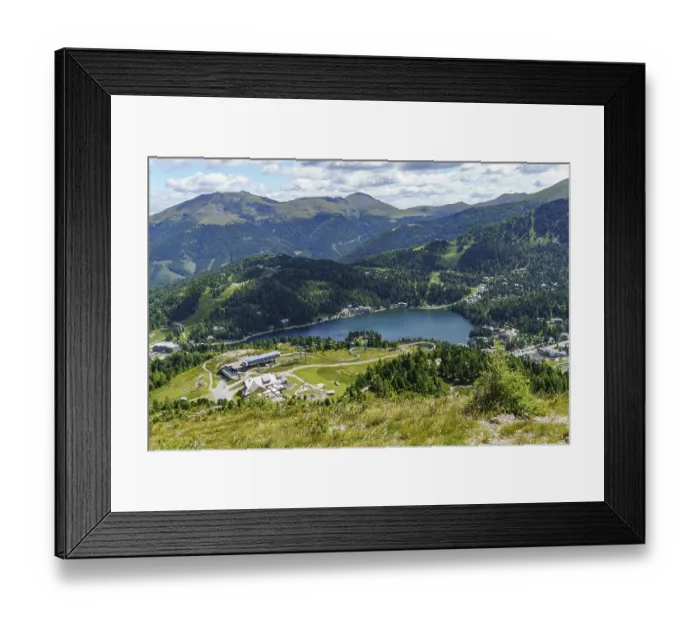 Framed Print : Sweeping views over a picturesque lake surrounded by mountains and forests Framed Print : Sweeping views over a picturesque lake surrounded by mountains and forests