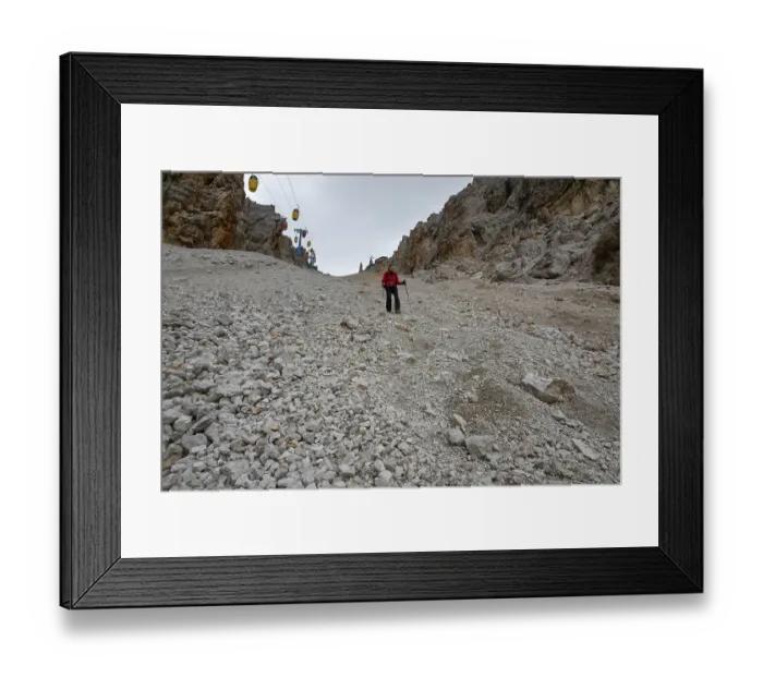 Framed Print : The descent of the tourist on the loose stones from the Forcella Staunies pass in the Dolomites Framed Print : The descent of the tourist on the loose stones from the Forcella Staunies pass in the Dolomites
