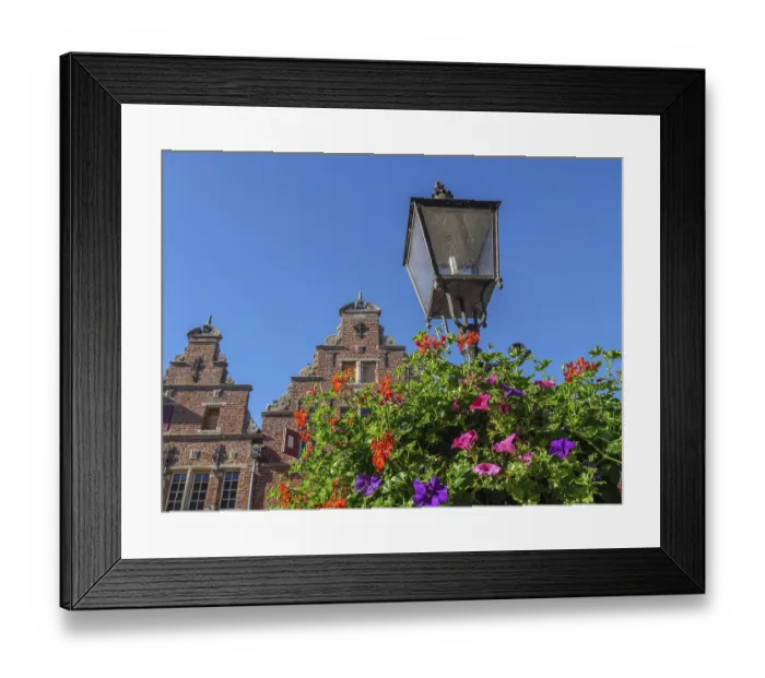 Framed Print : View of historic buildings and an old lantern against a clear blue sky