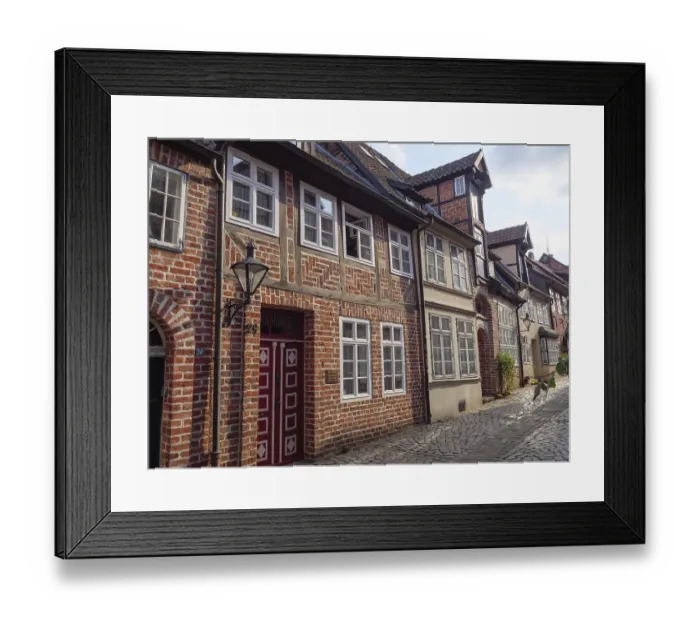 Framed Print : Alley with traditional half-timbered houses and lanterns