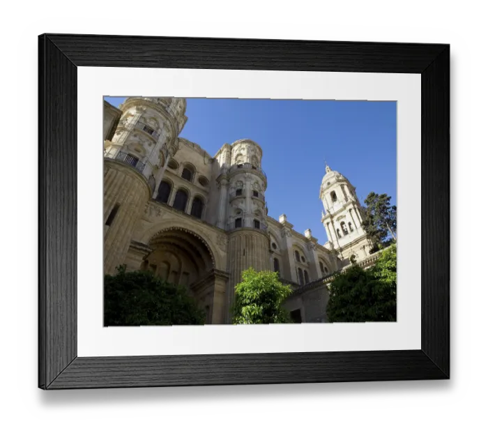 Framed Print : Imposing cathedral with two towers and richly decorated facades against a blue sky