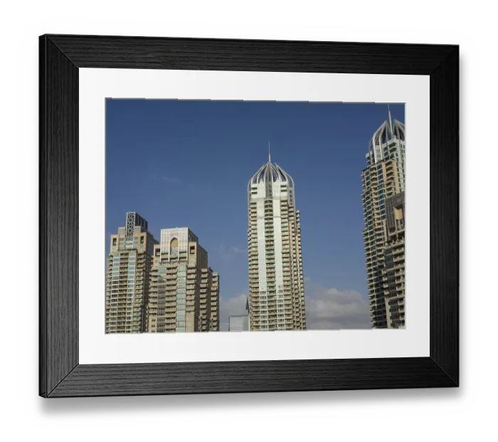Framed Print : Three modern skyscrapers with architectural details rise into the sky